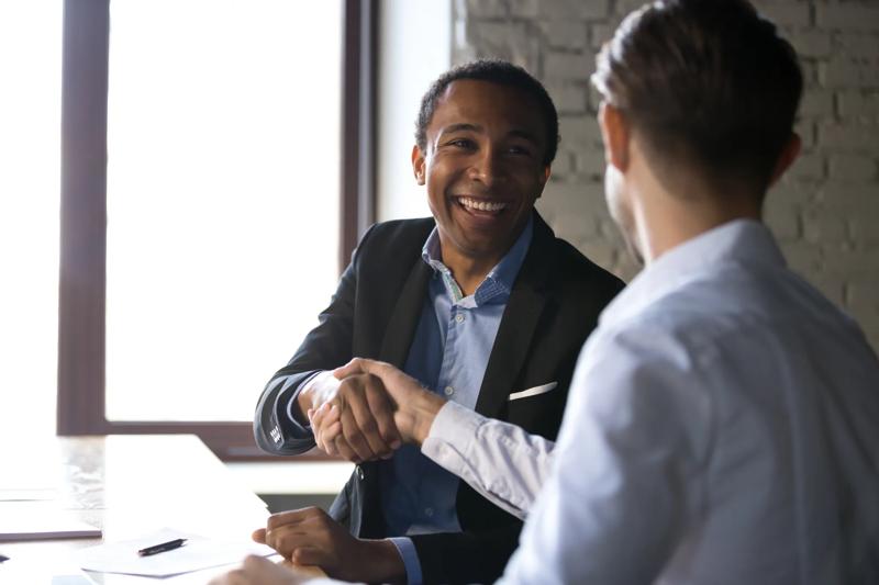 COLOUR-IMAGE_men-shaking-hands-smiling-zoomed_feb26