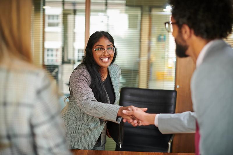 COLOUR-IMAGE_woman-shaking-hands_feb26