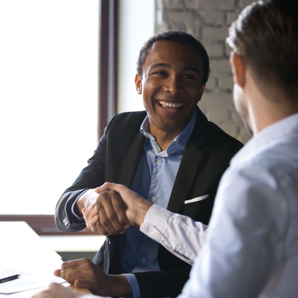 COLOUR-IMAGE_men-shaking-hands-smiling-zoomed_feb26