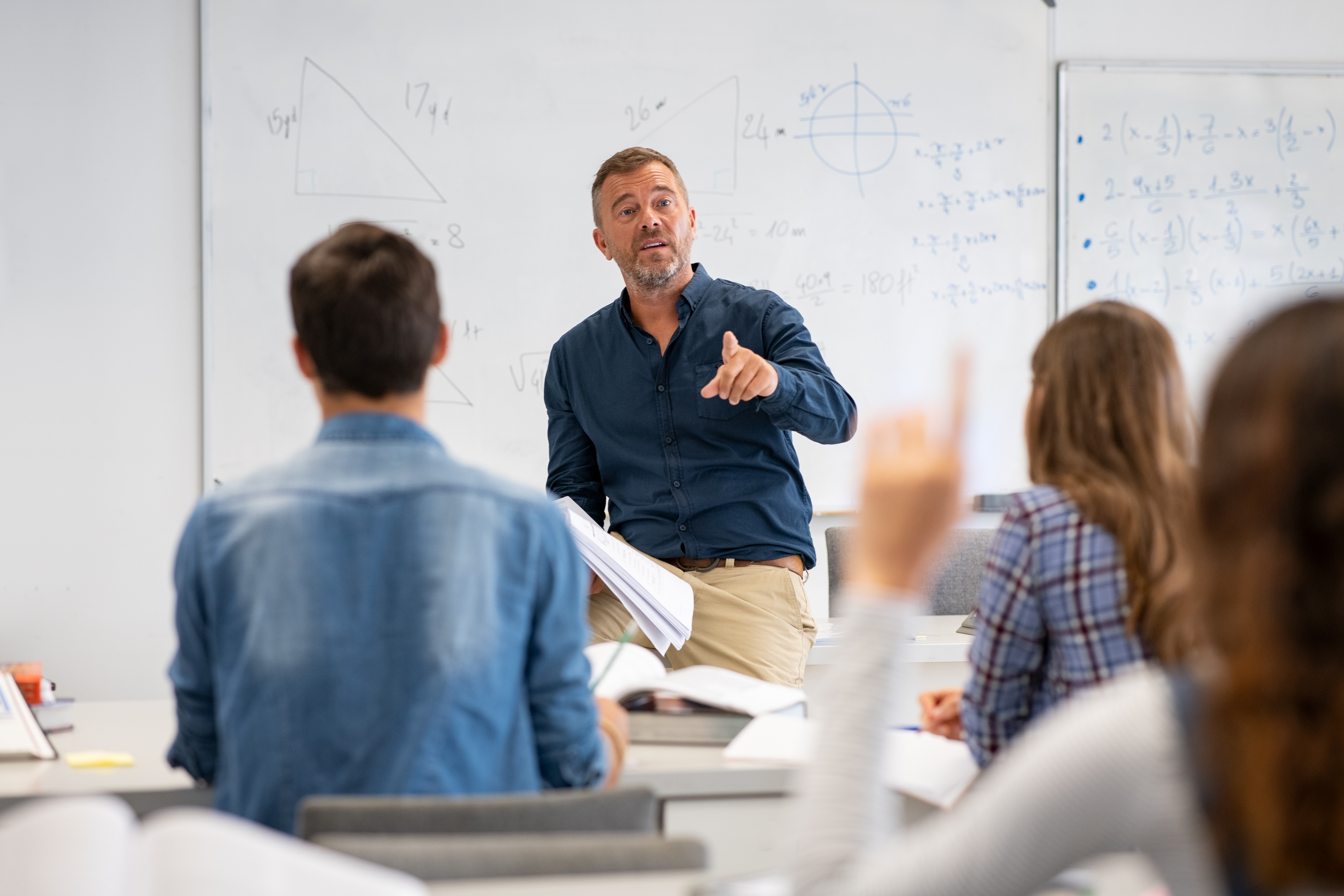 COLOUR-IMAGE-male teacher in high school class-feb26